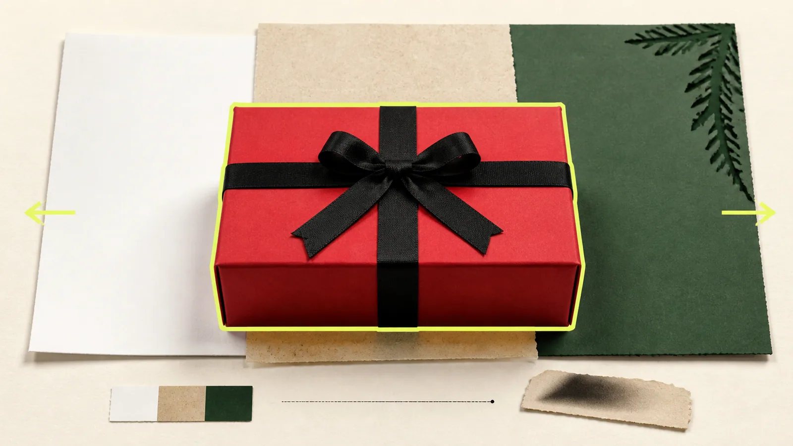 A protected red gift box placed over interchangeable white, stone, and green background papers.